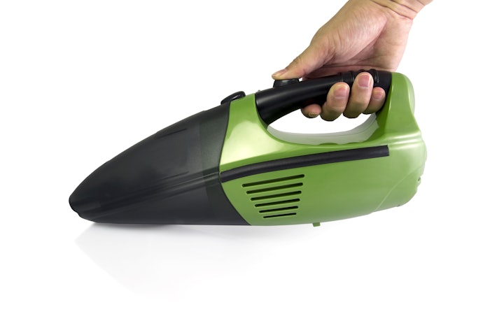 Vacuum Cleaner Sucks Out the Stuck Debris and Other Particles Under the Keys