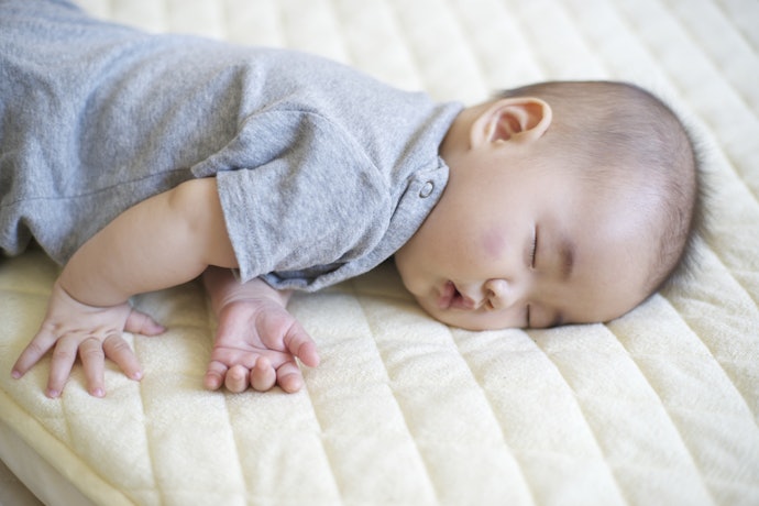 Pick a Flat, Firm, and Well-Fitting Mattress for Your Child’s Safety