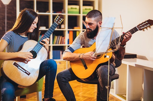 Select a Guitar With Low Action and a Slim Neck for Easier Playing