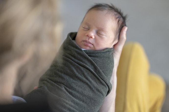 For Swaddling a Newborn: Opt for a Receiving Blanket