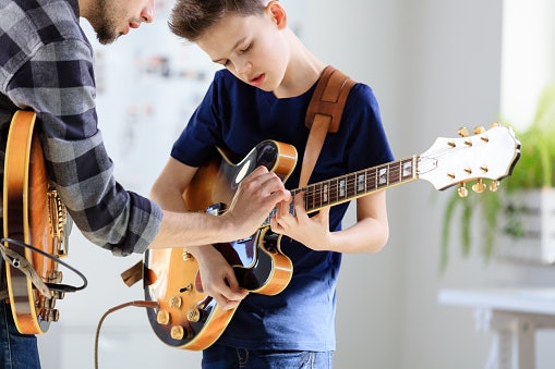For Easier Fretting and Amplified Play: Go for an Electric Guitar