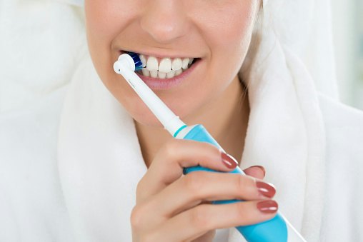 A Rotating or Oscillating Electric Toothbrush Buffs the Teeth and Effectively Removes Plaque From Hard to Reach Areas