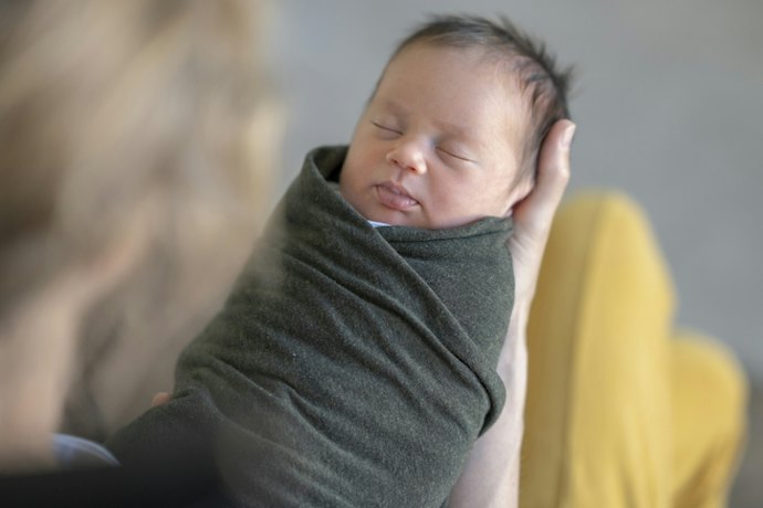 For Swaddling a Newborn: Opt for a Receiving Blanket